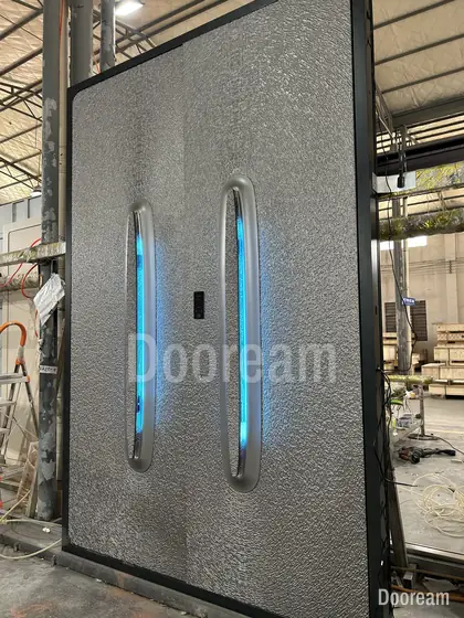 Textured double door with lit handles, photographed on our floor