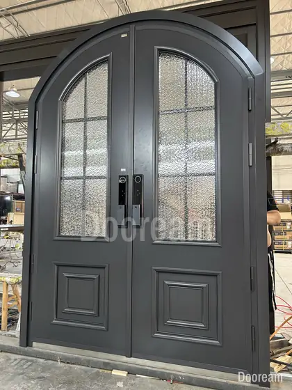 Black arched glazed double door, photographed on our floor