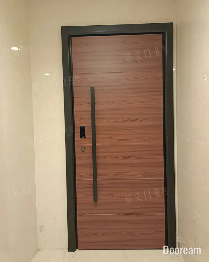 Wood-grain single door with a full-length black pull handle, installed at a client's home