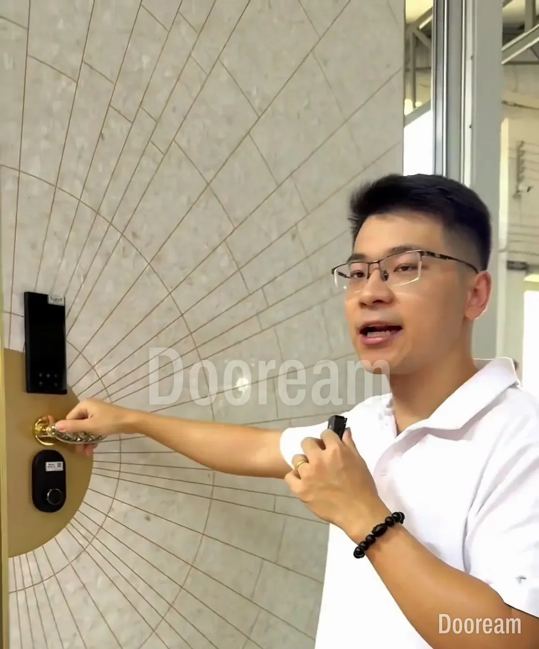 Alan showing the medallion lock on a shell-mosaic door