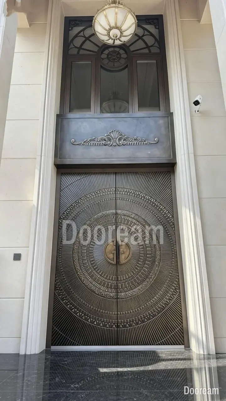 Door with an intricate circular pattern, under decorative glazing, installed