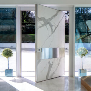 Luxury cream marble finish pivot door with horizontal stainless steel inlay handle and armored aluminum structure.