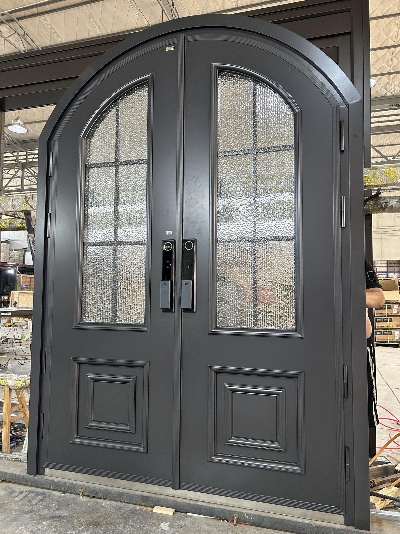 Custom cast-aluminum double entrance door in factory for project review
