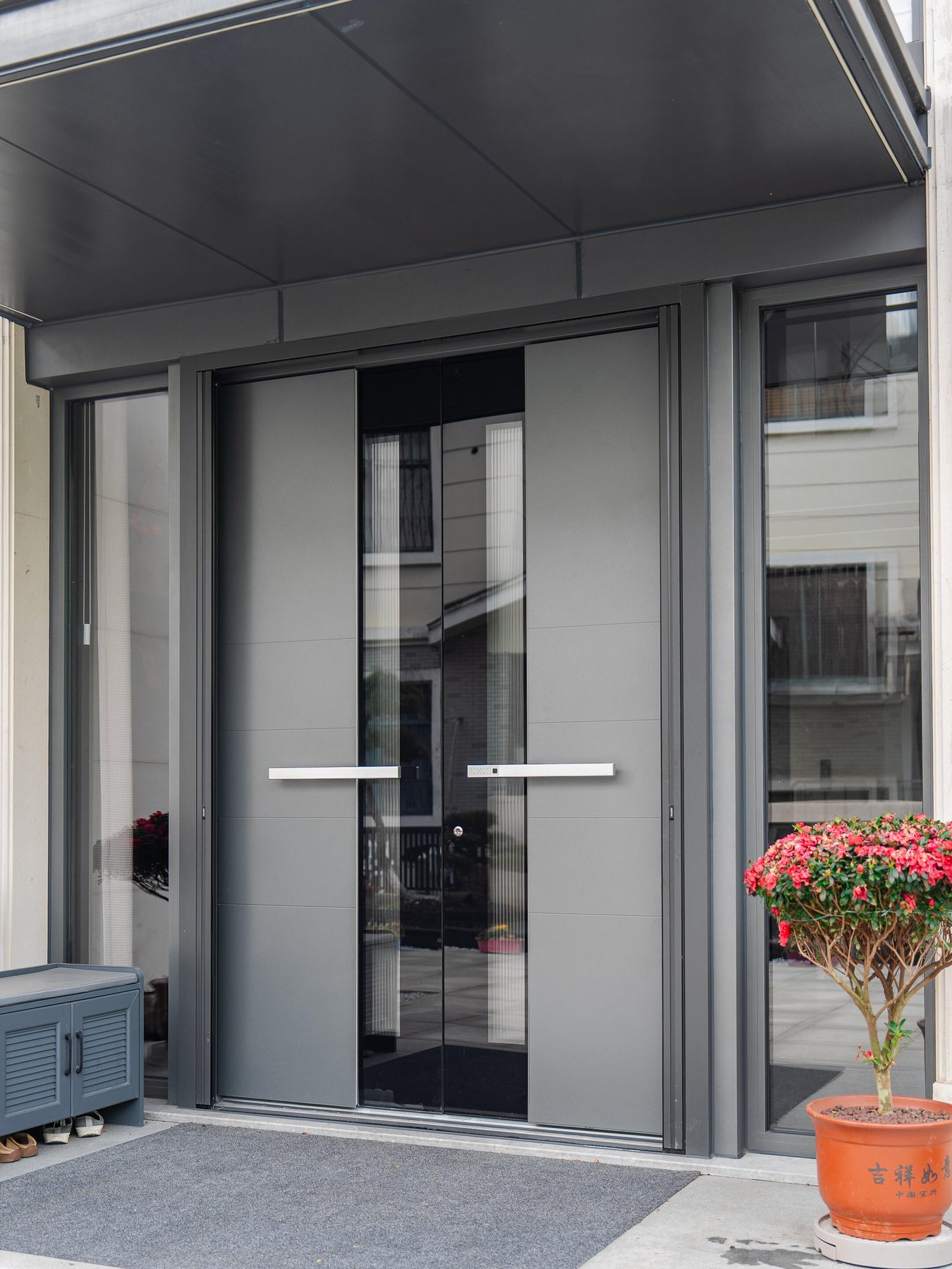 Double entrance door and side glass design reference for a UAE villa project brief