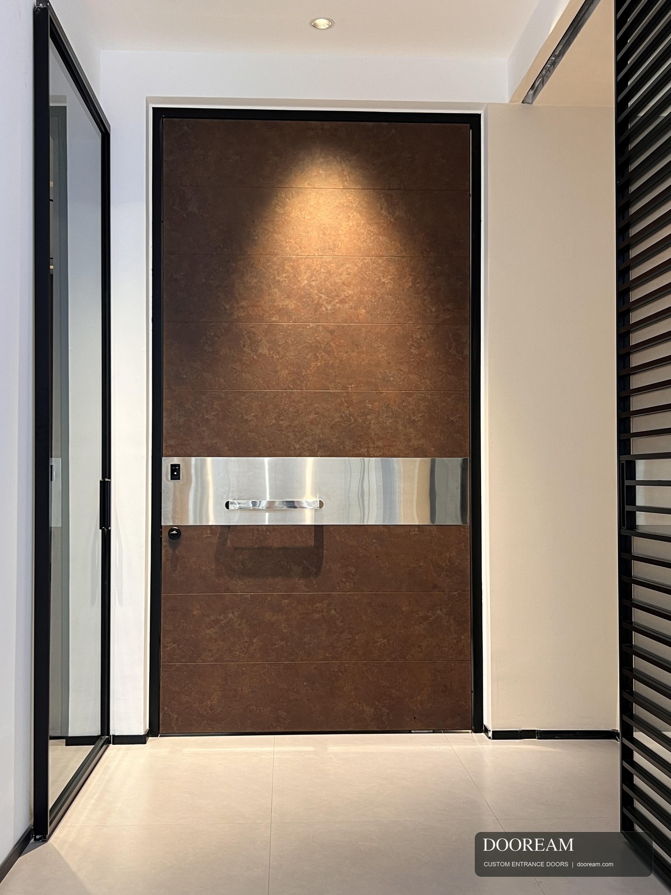 Warm bronze-look entrance design with horizontal panel lines and a contrasting metal handle band