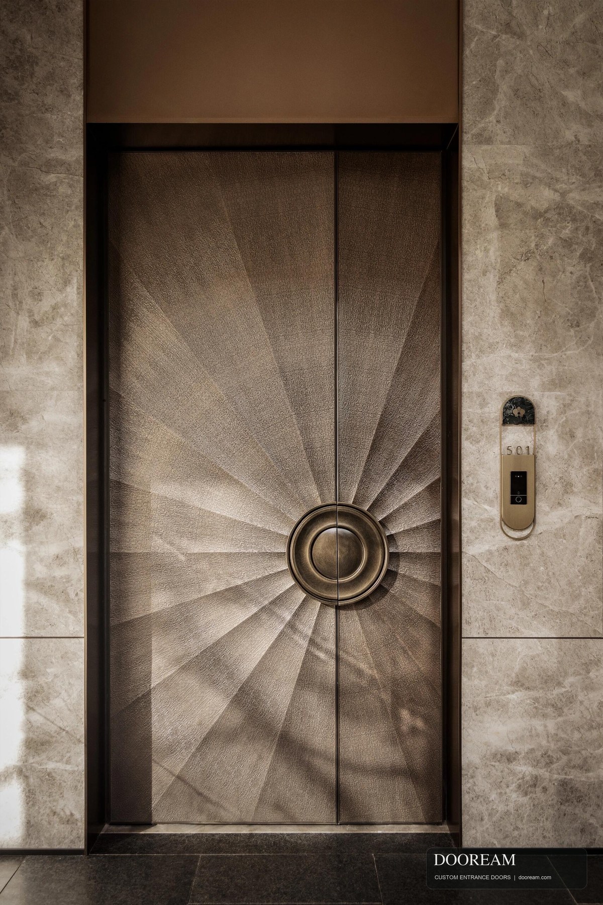 Sculptural double entrance door design reference with a radial pattern and circular central handle