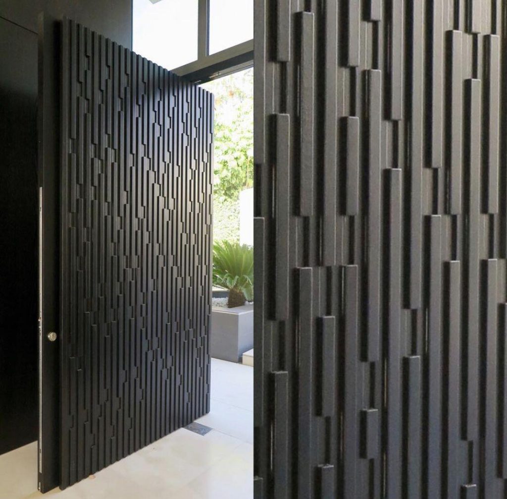 Black door with staggered vertical bar relief