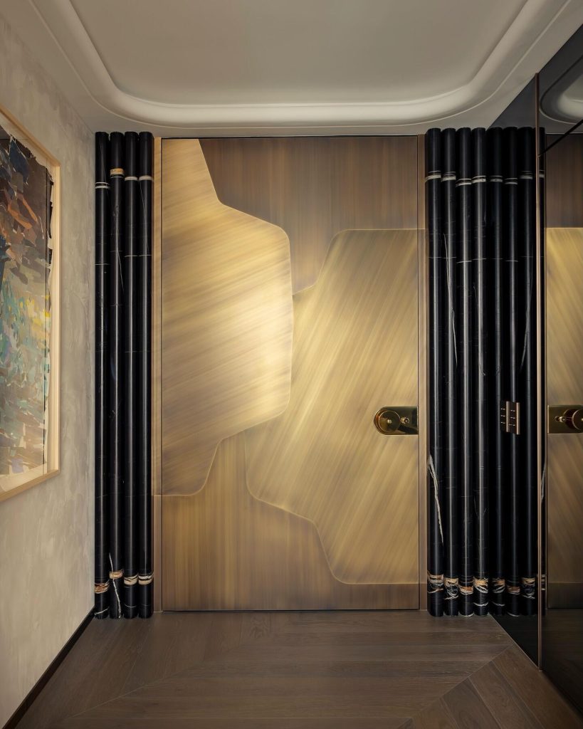 Champagne-gold door with sweeping curved pattern